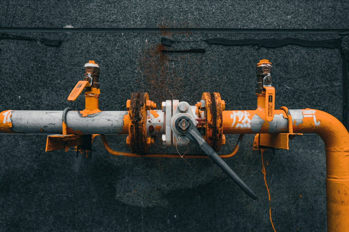Corroded orange pipes and valves needing repair