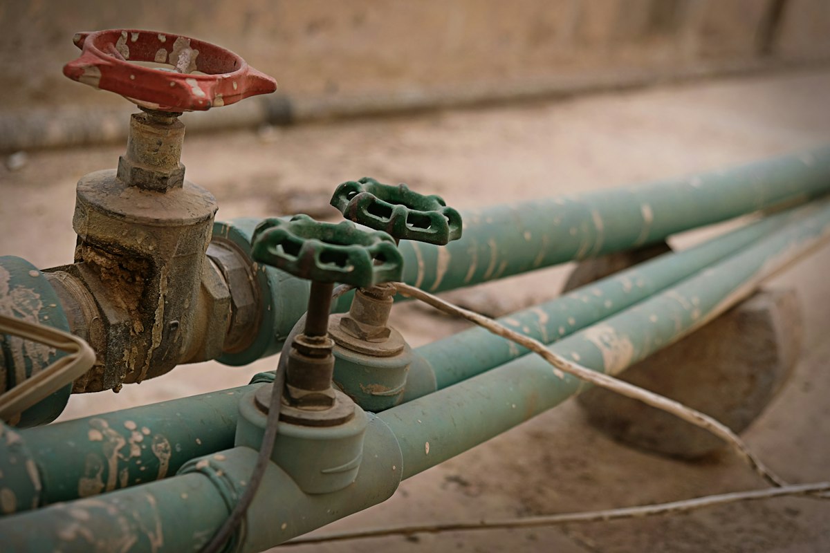 Green pipes with valve handles
