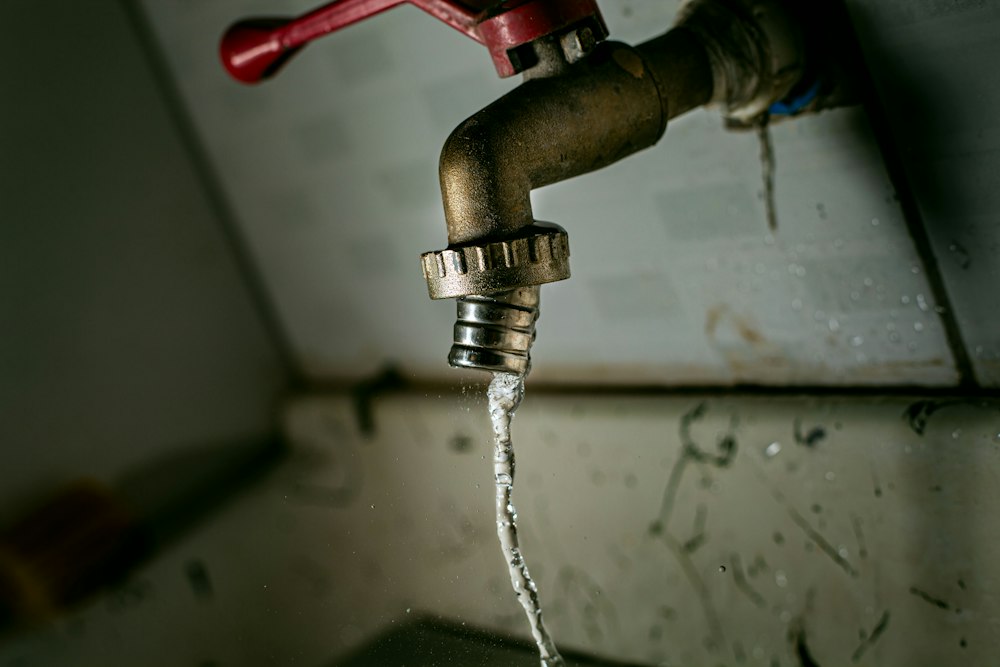 Water leaking from a tap and pipe connection
