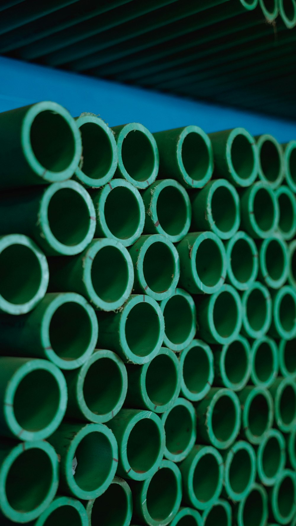Stack of green PPR water supply pipes