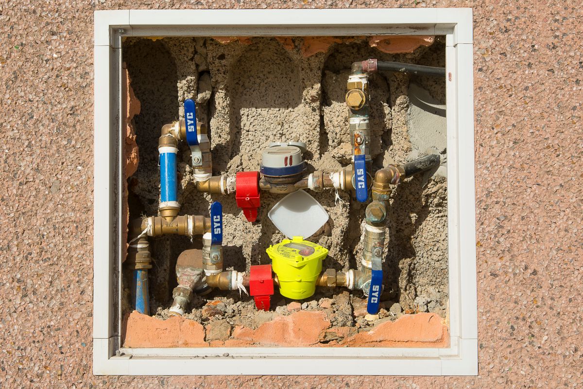 Water meter and valve assembly used to check for hidden leaks