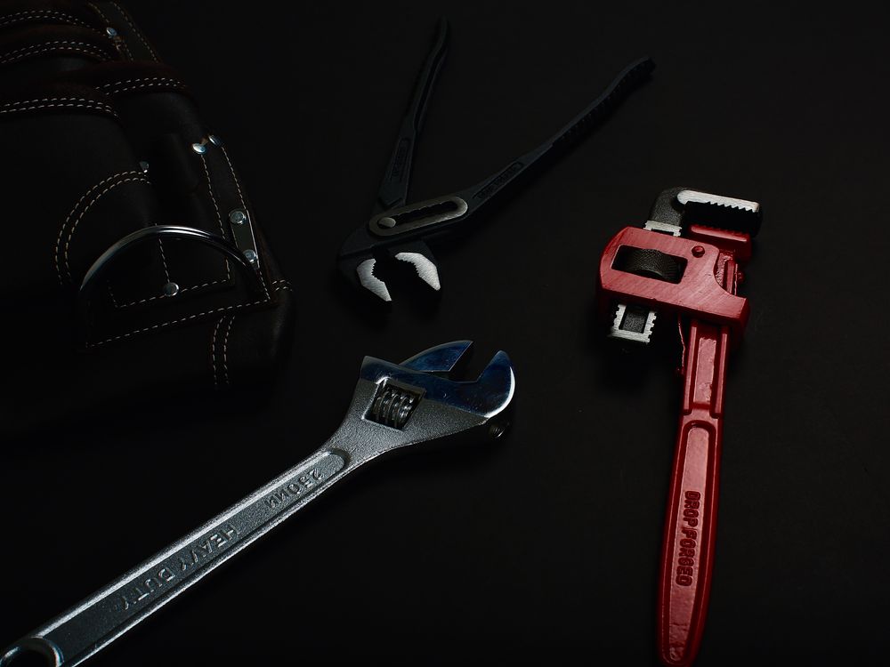 Wrenches and pliers used for pipe repair